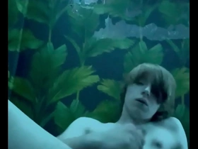 Young gay man masturbates and ejaculates.