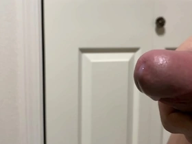 Close up view of a slow motion cumshot while jerking off