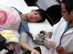 Young Asian man gets examined and penetrated by a doctor in uniform.