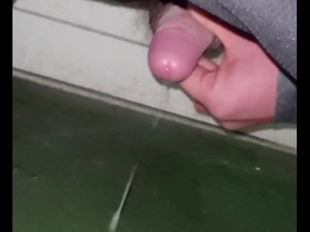 Japanese gay man masturbates while bent over.