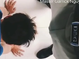 An Asian man is submissive to his master in this porn video.