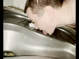A gay boy caught in the act of pleasuring himself in a public bathroom at the beach.