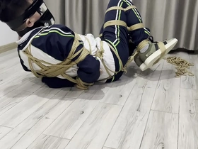 Young Asian boy in a BDSM scene with a blindfold, bondage, and a messy ending.
