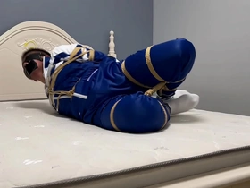Gay Asian boy in hogtie bondage with blindfold and tape gag