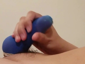 Asian man masturbates with blue penis stockings and cum toys